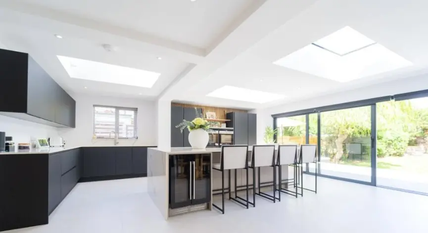 Modern kitchen with sprayed cupboard doors and a large island