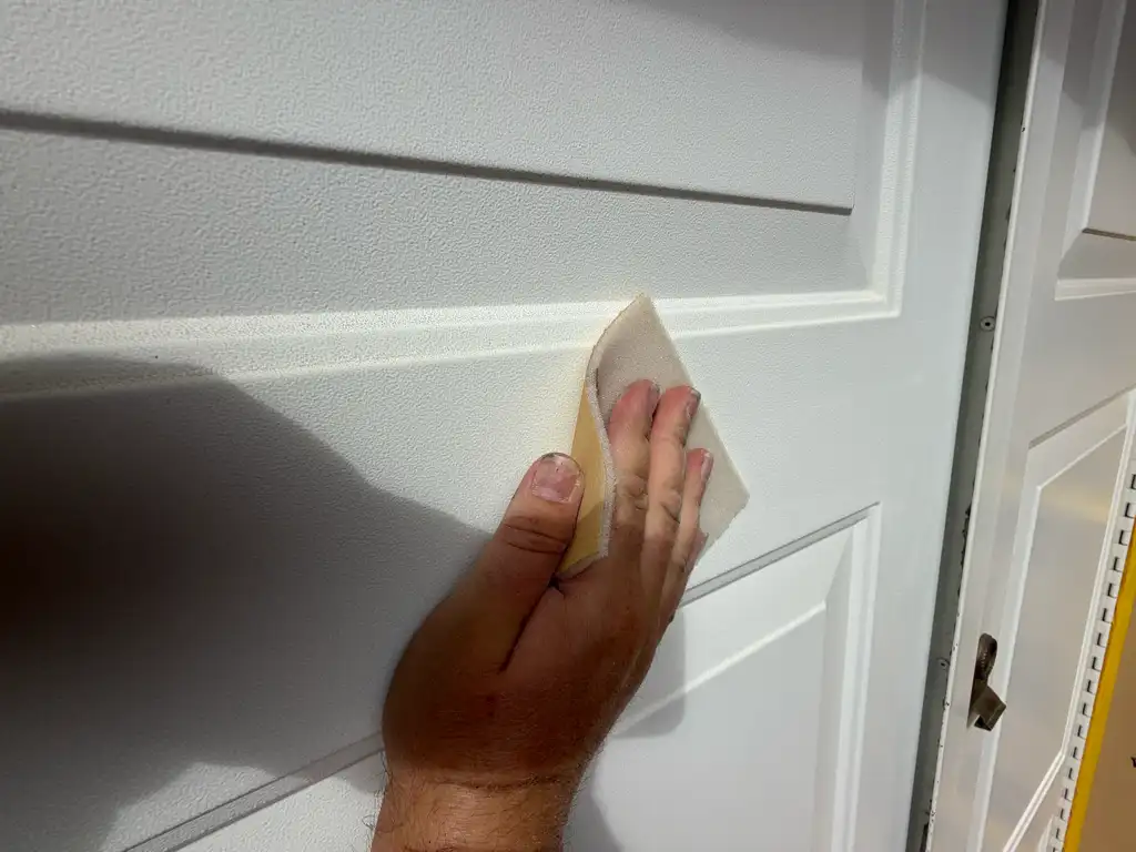 Careful preparation of panelled door in Birmingham