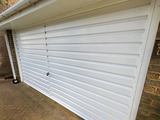 professionally sprayed white garage door