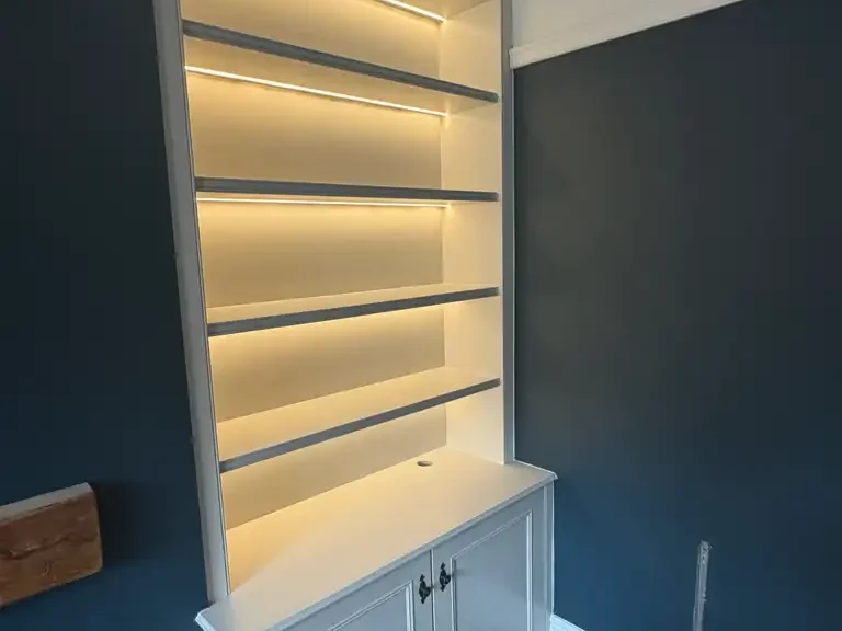 Professionally sprayed built in bookshelves
